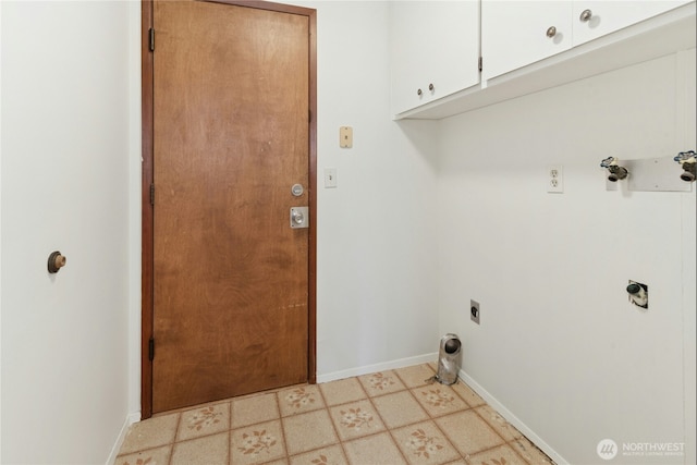 laundry room with cabinet space, baseboards, and electric dryer hookup