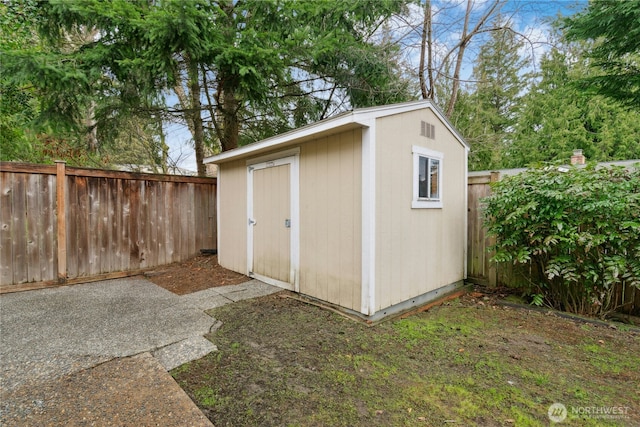 view of shed featuring a fenced backyard