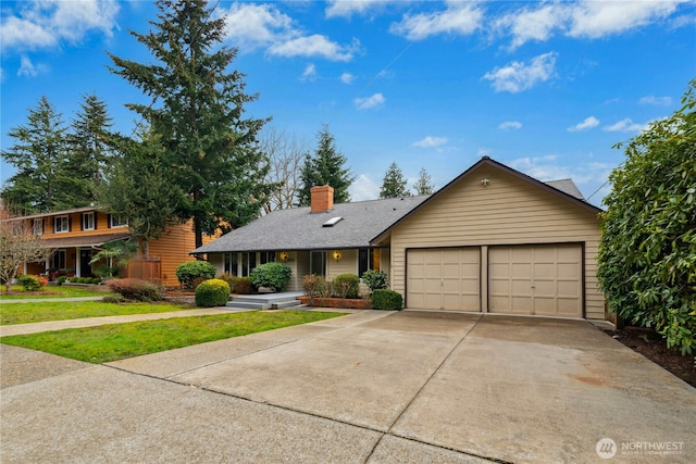 single story home featuring a shingled roof, concrete driveway, a chimney, an attached garage, and a front lawn