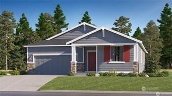 view of front of property with a garage, concrete driveway, and a front yard