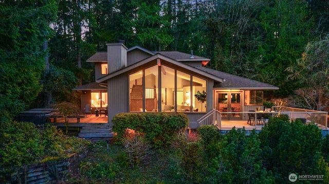 rear view of property with french doors and a deck