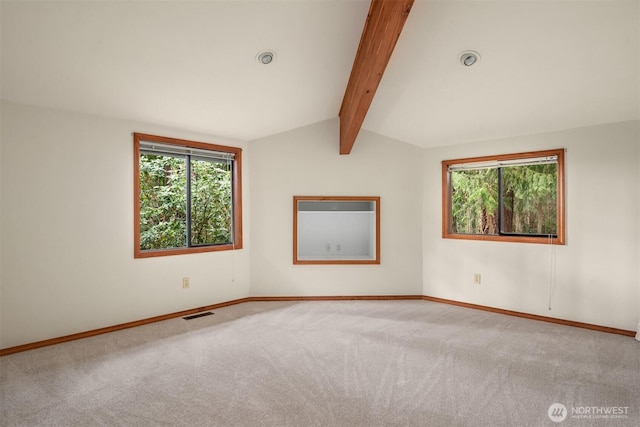 carpeted empty room featuring vaulted ceiling with beams, baseboards, and visible vents