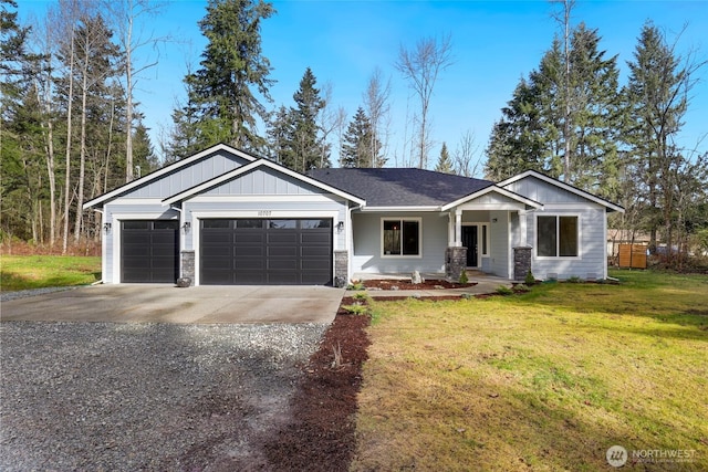 view of front facade with a front yard, driveway, an attached garage, stone siding, and board and batten siding