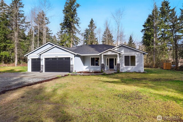 10707 212th St E, Graham, WA 98338 - view of front facade featuring a front lawn, stone siding, concrete driveway, a shingled roof, and a garage