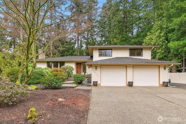 view of front of property featuring concrete driveway