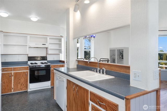 kitchen featuring open shelves, gas stove, a sink, dishwasher, and under cabinet range hood