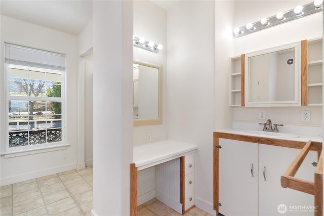 bathroom with baseboards and vanity