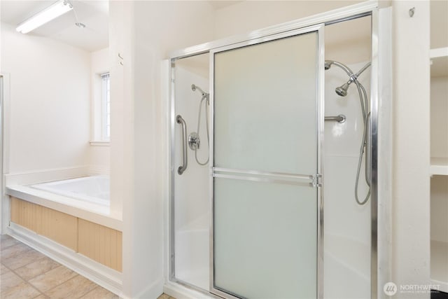 full bathroom with a garden tub and a shower stall