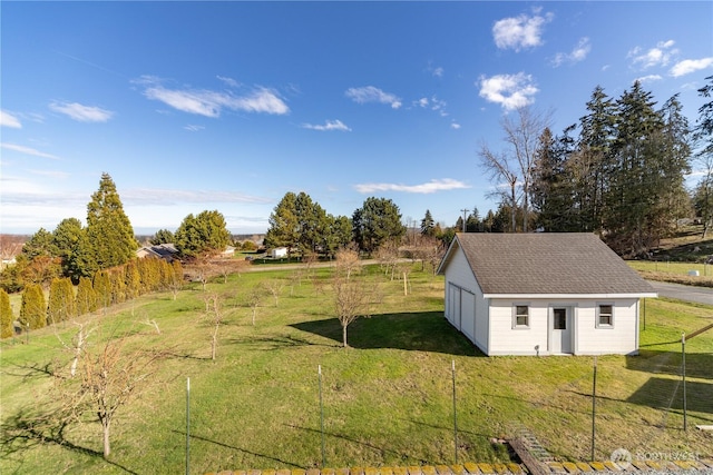 exterior space with an outbuilding, a storage shed, and fence