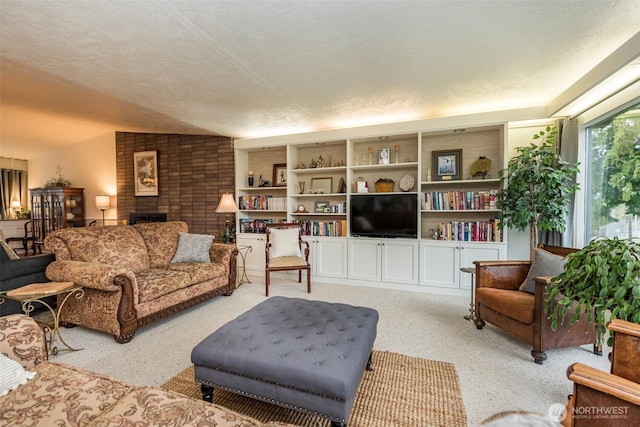 living room featuring light carpet, a fireplace, and a textured ceiling