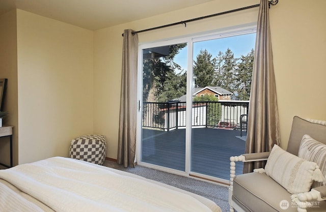 bedroom featuring access to outside and carpet flooring