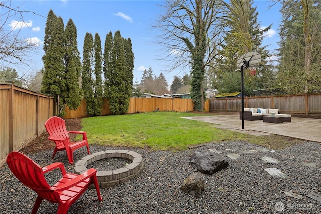 view of yard featuring an outdoor living space with a fire pit, a patio area, and a fenced backyard