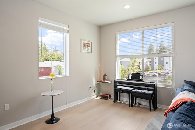 living area featuring wood finished floors and baseboards