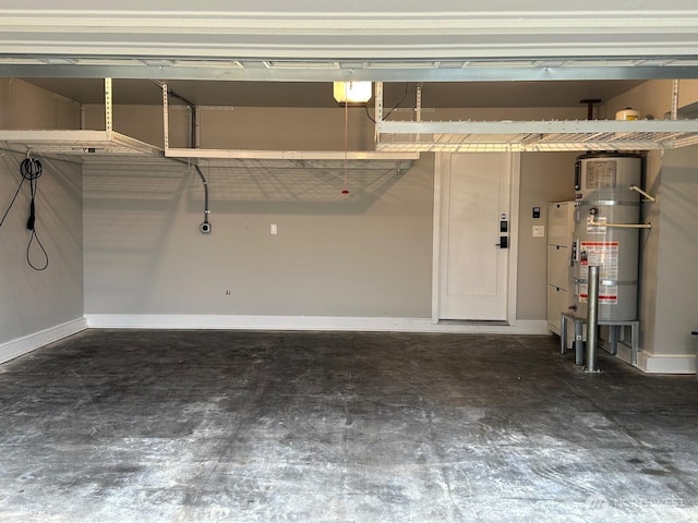 garage featuring secured water heater and baseboards