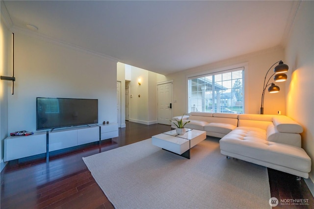 living room featuring crown molding and wood finished floors