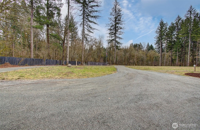 view of road featuring a forest view