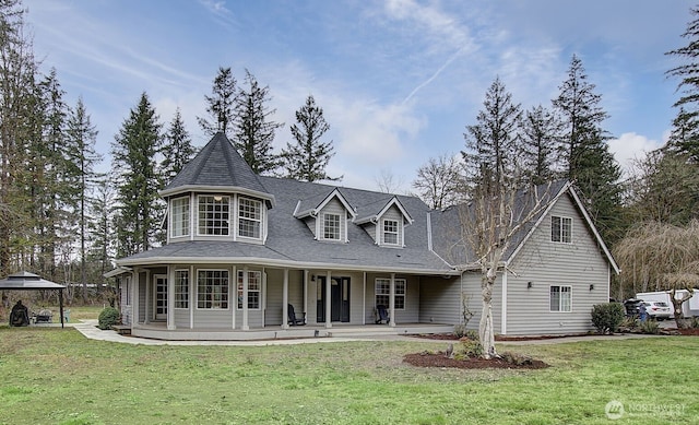 view of front of home featuring a gazebo and a front yard