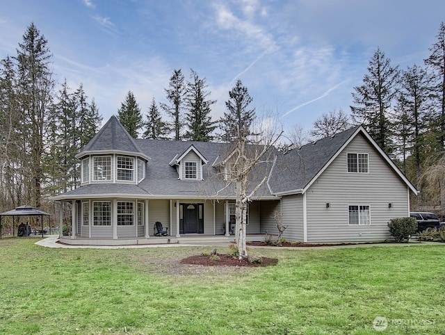 16100 NE Beebe Rd, Battle Ground, WA 98604 - rear view of property featuring a porch, a lawn, and a shingled roof