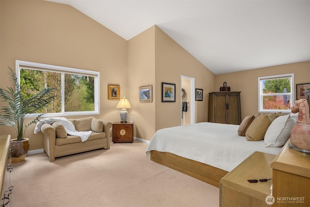 carpeted bedroom with baseboards and vaulted ceiling