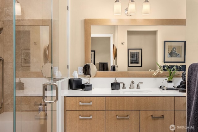 full bath with a stall shower and vanity