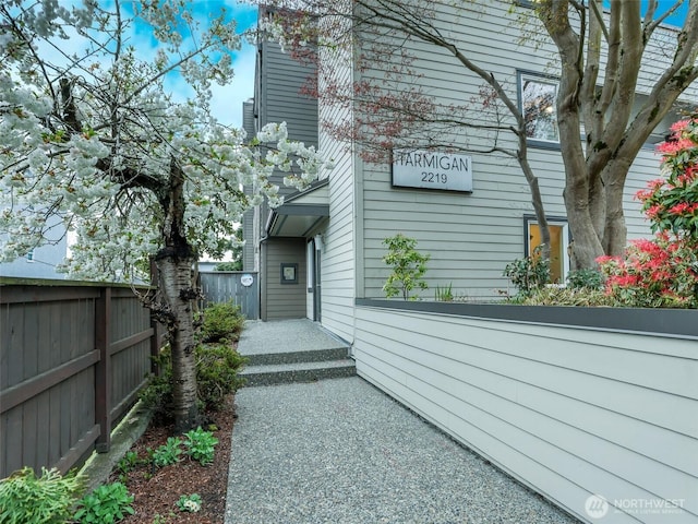 view of property exterior with fence