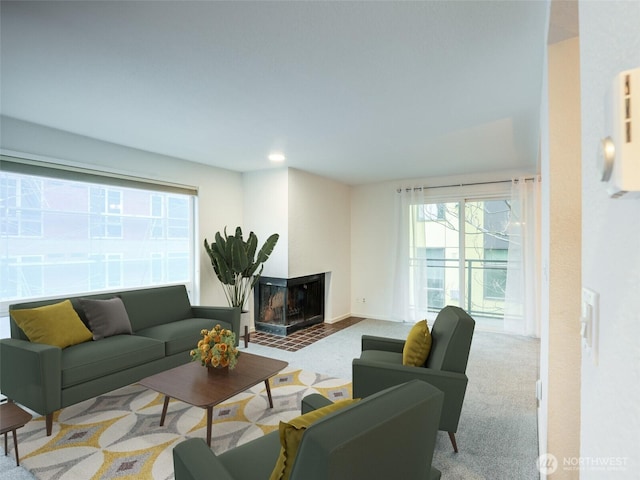 living area featuring recessed lighting, baseboards, carpet flooring, and a multi sided fireplace