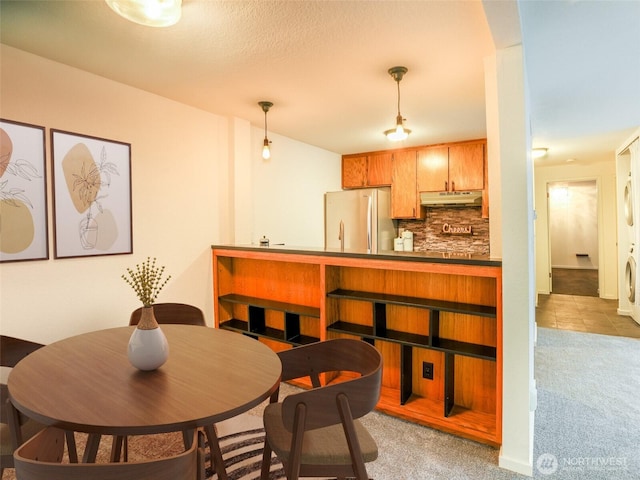 view of carpeted dining space