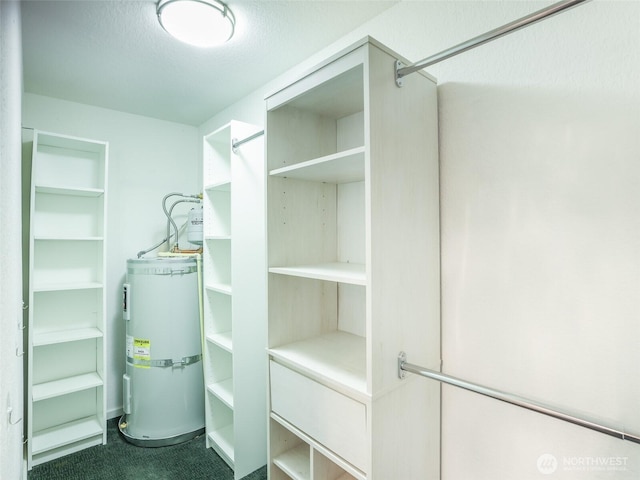 utility room featuring secured water heater