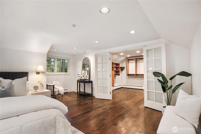 bedroom featuring lofted ceiling, french doors, hardwood / wood-style floors, and recessed lighting