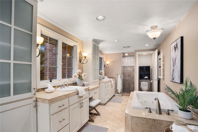 bathroom with tile patterned flooring, a sink, visible vents, a whirlpool tub, and a stall shower