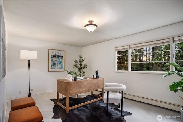 carpeted home office with a baseboard radiator