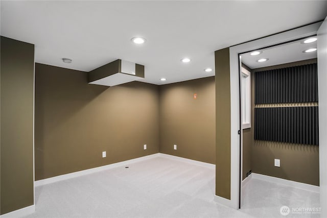 unfurnished room with carpet floors, baseboards, and recessed lighting