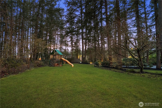 view of jungle gym with a lawn