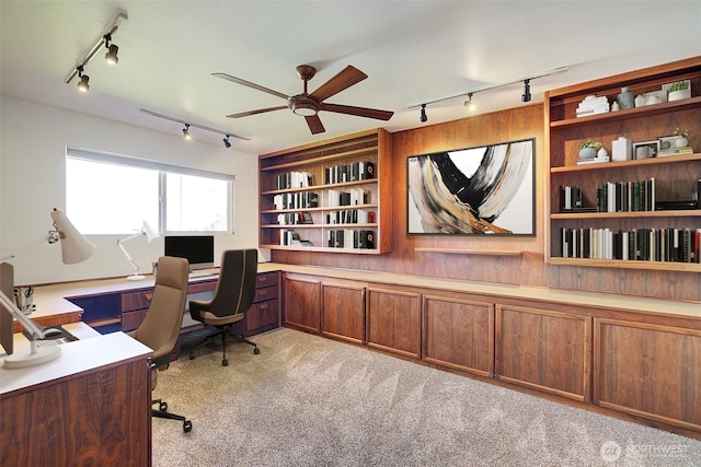 office area with light carpet, rail lighting, built in features, and a ceiling fan