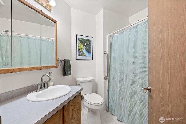 full bathroom with curtained shower, vanity, toilet, and tile patterned floors