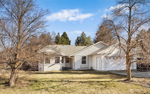 single story home featuring driveway, an attached garage, and a front yard