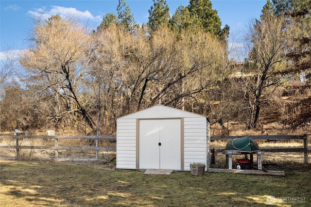 view of shed with fence