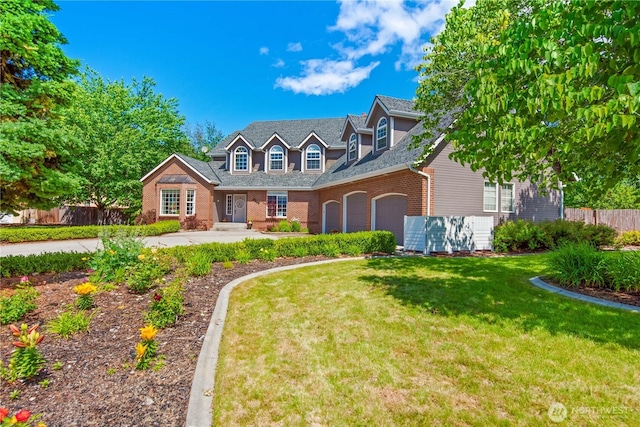 new england style home with an attached garage, brick siding, fence, and a front lawn