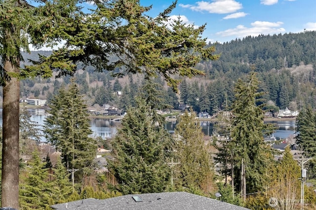 exterior space featuring a view of trees