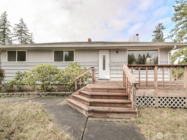 view of front of property with a wooden deck