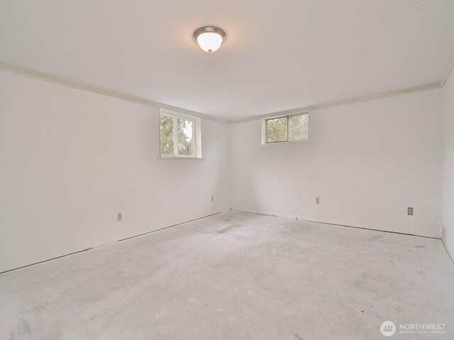 unfurnished room with unfinished concrete floors