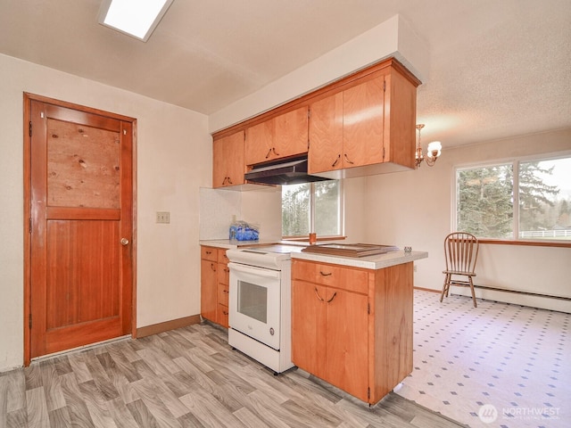 kitchen featuring a baseboard heating unit, light countertops, under cabinet range hood, and white range with electric cooktop