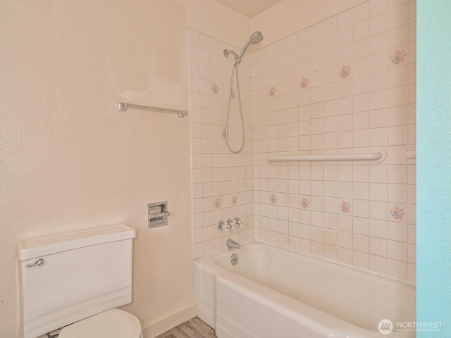 full bath with toilet, baseboards,  shower combination, and wood finished floors