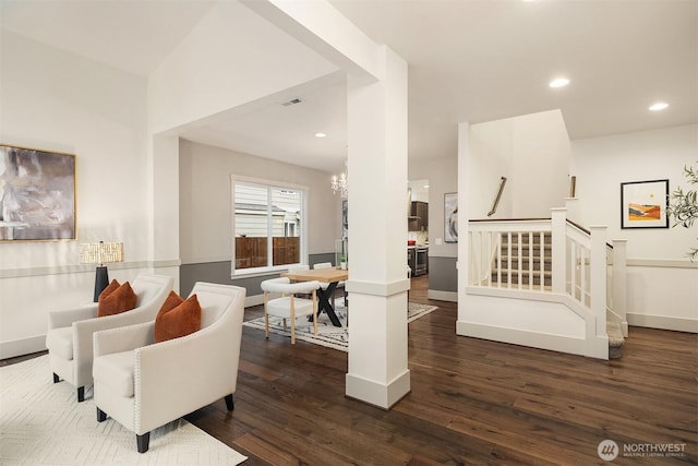 interior space featuring recessed lighting, a chandelier, dark wood-style flooring, and stairs