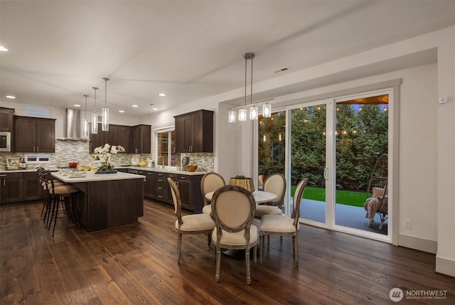 dining area with recessed lighting, visible vents, and dark wood-style flooring