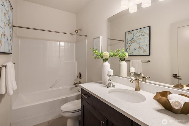 full bath featuring toilet, shower / washtub combination, and vanity