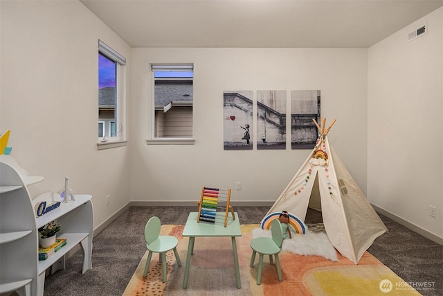 recreation room with visible vents, carpet flooring, and baseboards