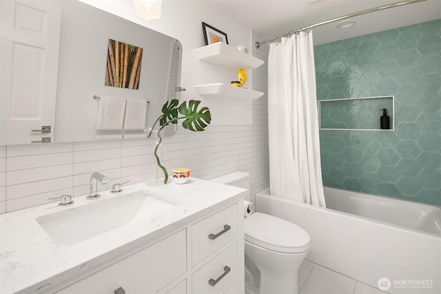 bathroom featuring vanity, tile patterned flooring, shower / tub combo, tile walls, and toilet