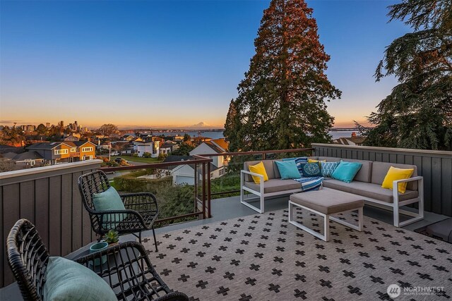 view of patio featuring a residential view, an outdoor living space, and a balcony