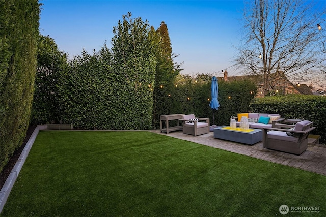 view of yard with an outdoor living space, a patio area, and fence